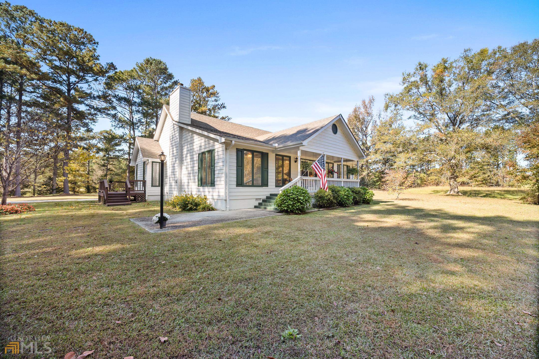 1425 Concord Road Concord, GA 30206 - Photo 1 of 1 a view of a house with backyard and tree s