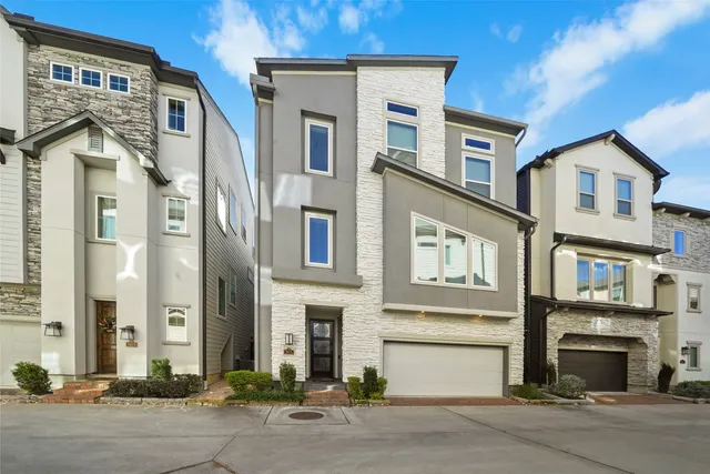 a front view of a residential houses with a street
