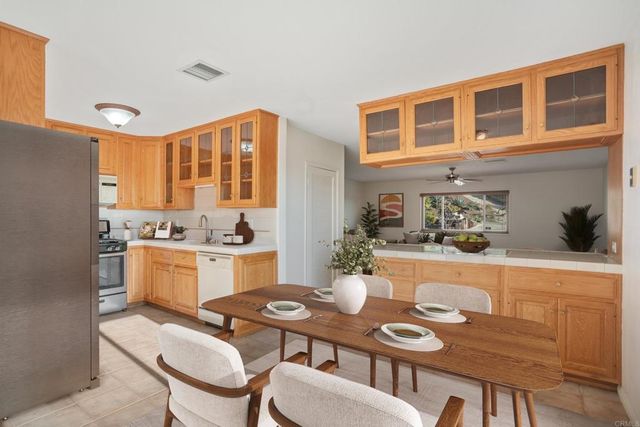 a kitchen with a stove top oven sink and cabinets