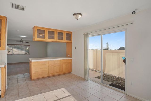 a bedroom with bed and a potted plant