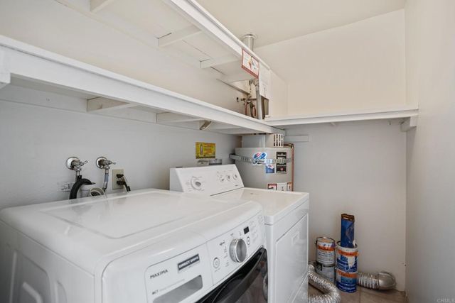 an aerial view of a house with a yard and mountain