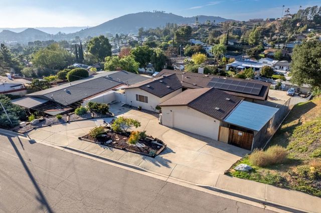 an aerial view of a house with a garden