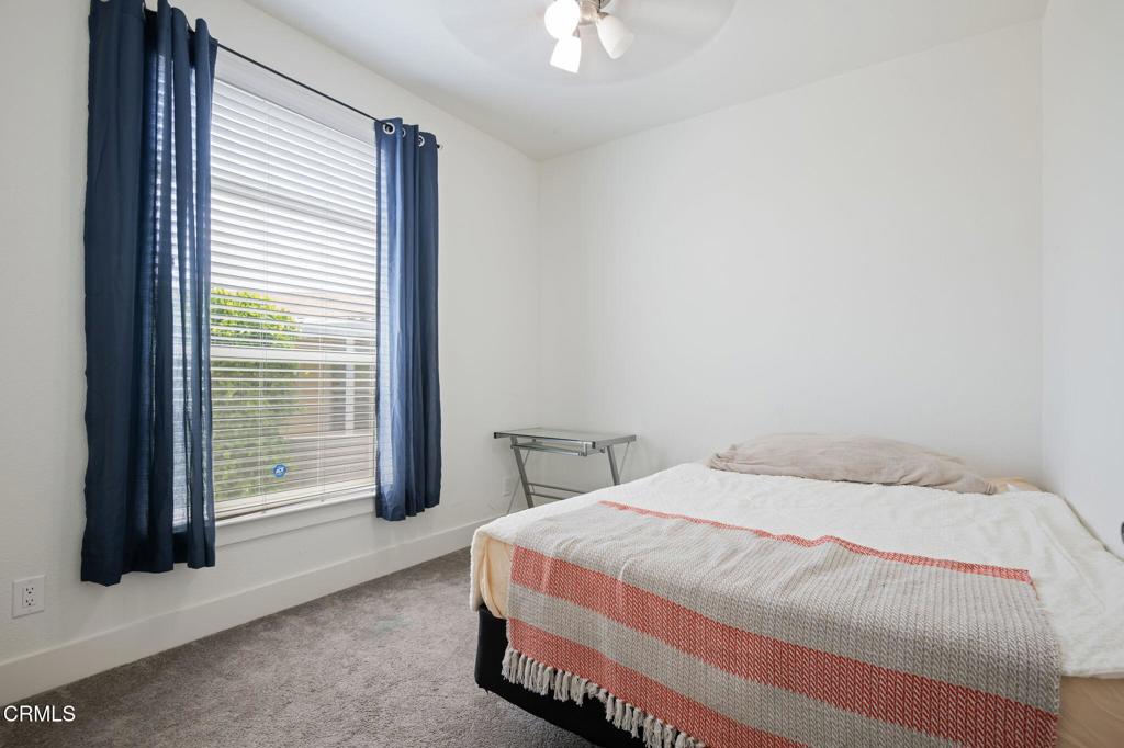 11100 Telegraph Road, Unit 88 Ventura, CA 93004 - Photo 13 of 24 a bedroom with a bed and a window