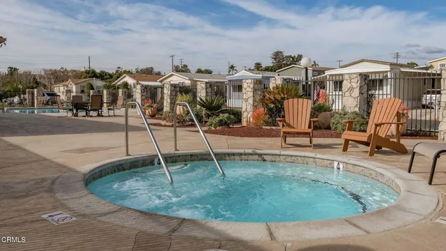 a view of a house with basketball court
