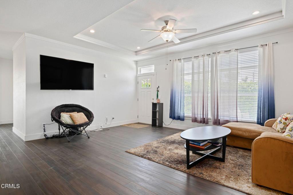 11100 Telegraph Road, Unit 88 Ventura, CA 93004 - Photo 3 of 24 a living room with furniture and a flat screen tv