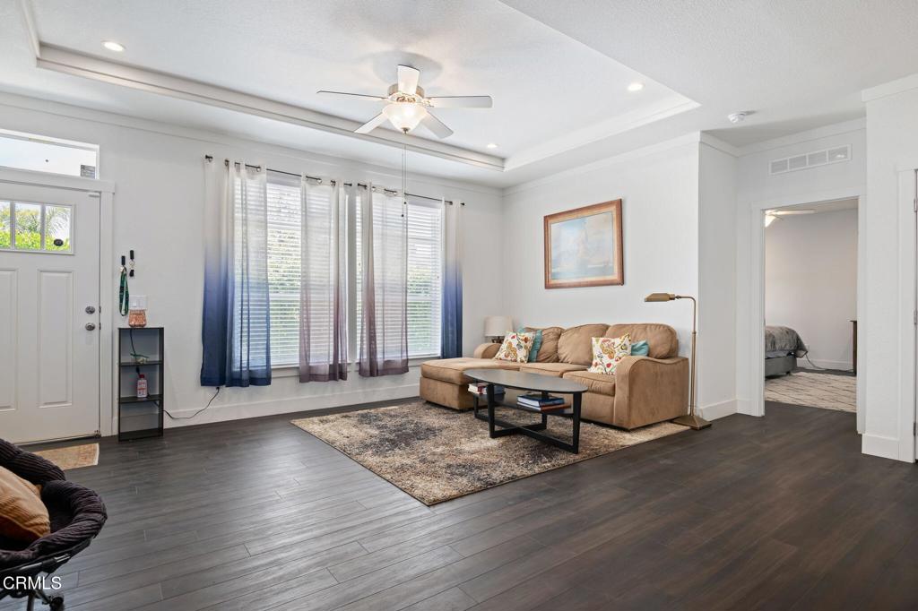 11100 Telegraph Road, Unit 88 Ventura, CA 93004 - Photo 4 of 24 a living room with furniture and wooden floor