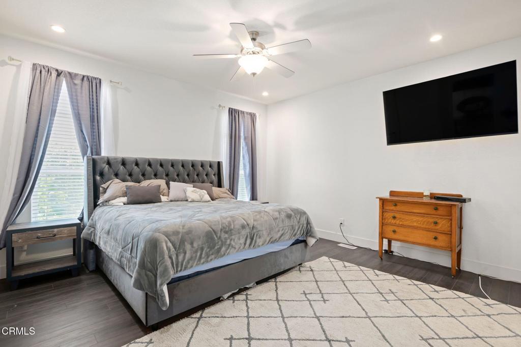 11100 Telegraph Road, Unit 88 Ventura, CA 93004 - Photo 10 of 24 a bedroom with a bed and a flat screen tv