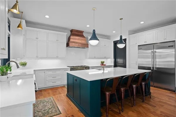 a view of kitchen and dining area with furniture