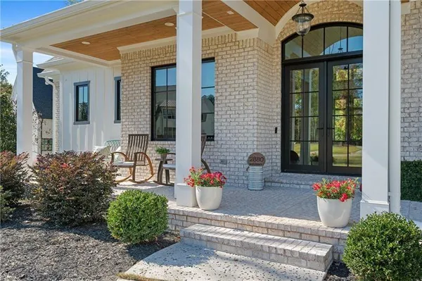 a living room with furniture fireplace and flat screen tv