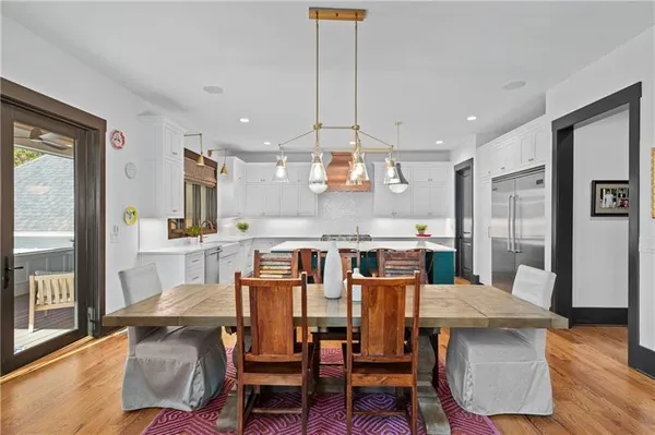 a spacious bathroom with a shower sink and mirror