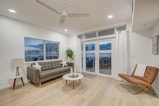 a living room with furniture and a potted plant