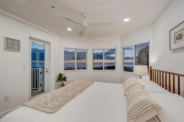 a bedroom with a large bed and a window