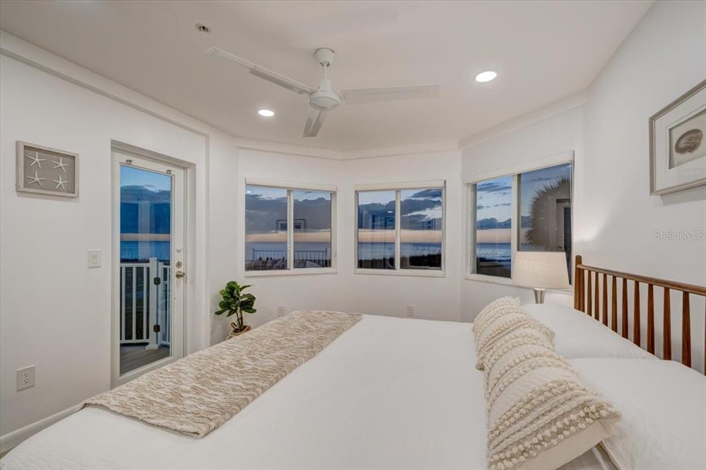 17852 Lee Avenue Redington Shores, FL 33708 - Photo 19 of 38 a bedroom with a large bed and a window