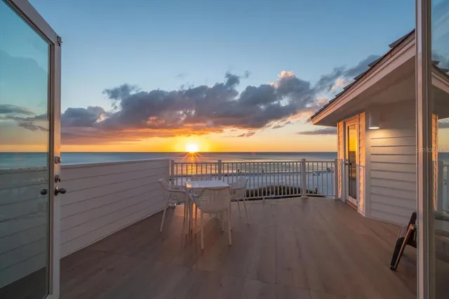 a view of balcony with furniture