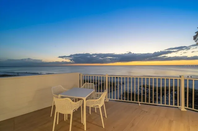 a view of a chairs and table on the wooden floor