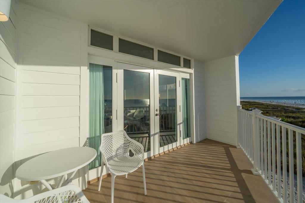 17852 Lee Avenue Redington Shores, FL 33708 - Photo 34 of 38 a balcony with table and chairs