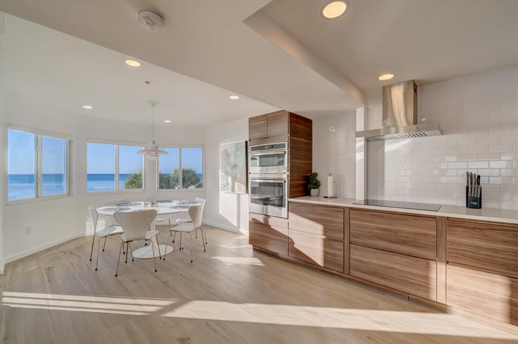 17852 Lee Avenue Redington Shores, FL 33708 - Photo 4 of 38 a kitchen with stainless steel appliances granite countertop a sink and a refrigerator
