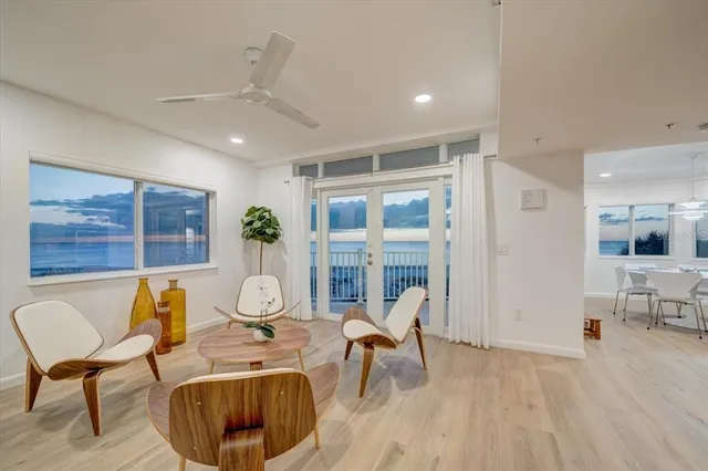 a living room with furniture a table and chairs