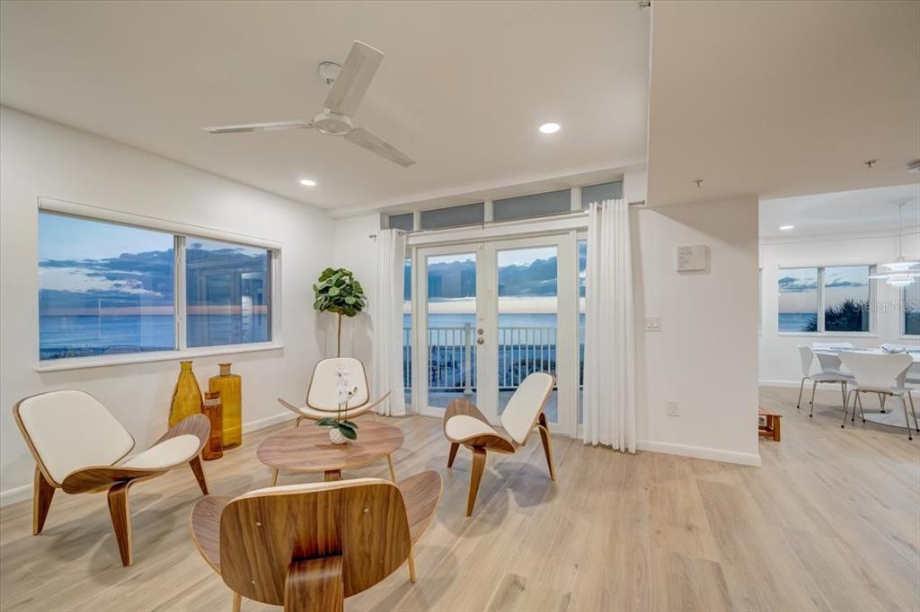 17852 Lee Avenue Redington Shores, FL 33708 - Photo 7 of 38 a living room with furniture a table and chairs
