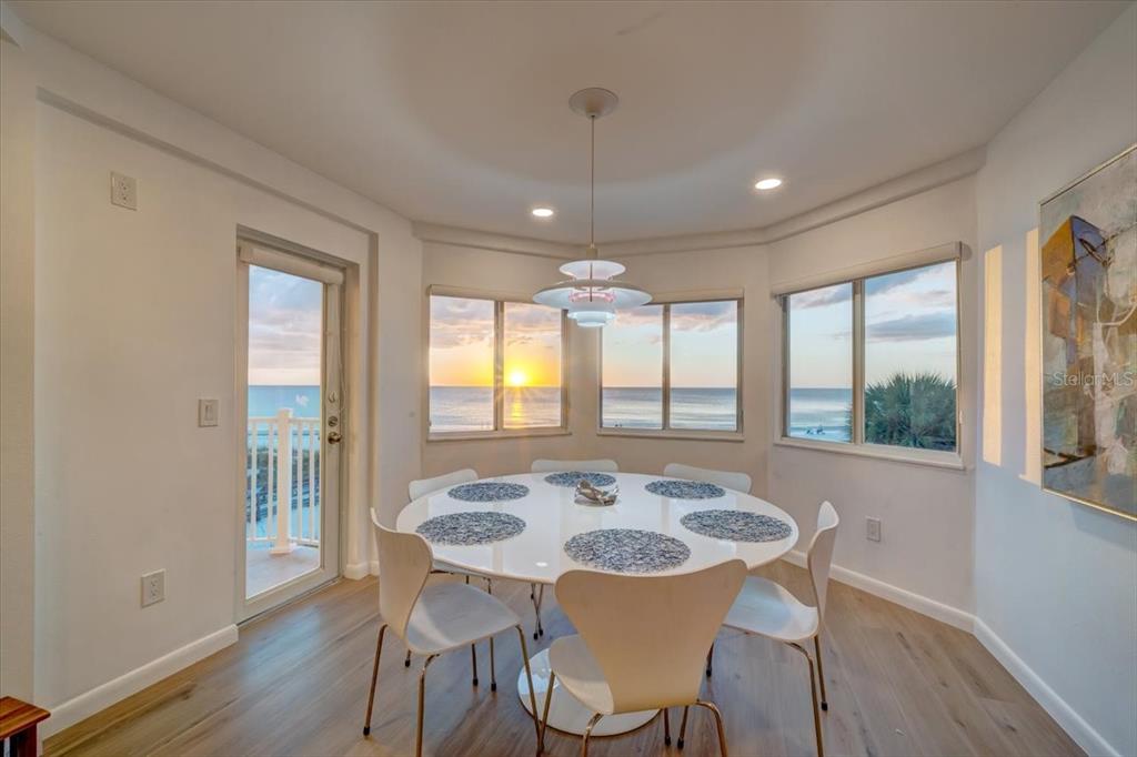 17852 Lee Avenue Redington Shores, FL 33708 - Photo 9 of 38 a view of a dining room with furniture window and wooden floor