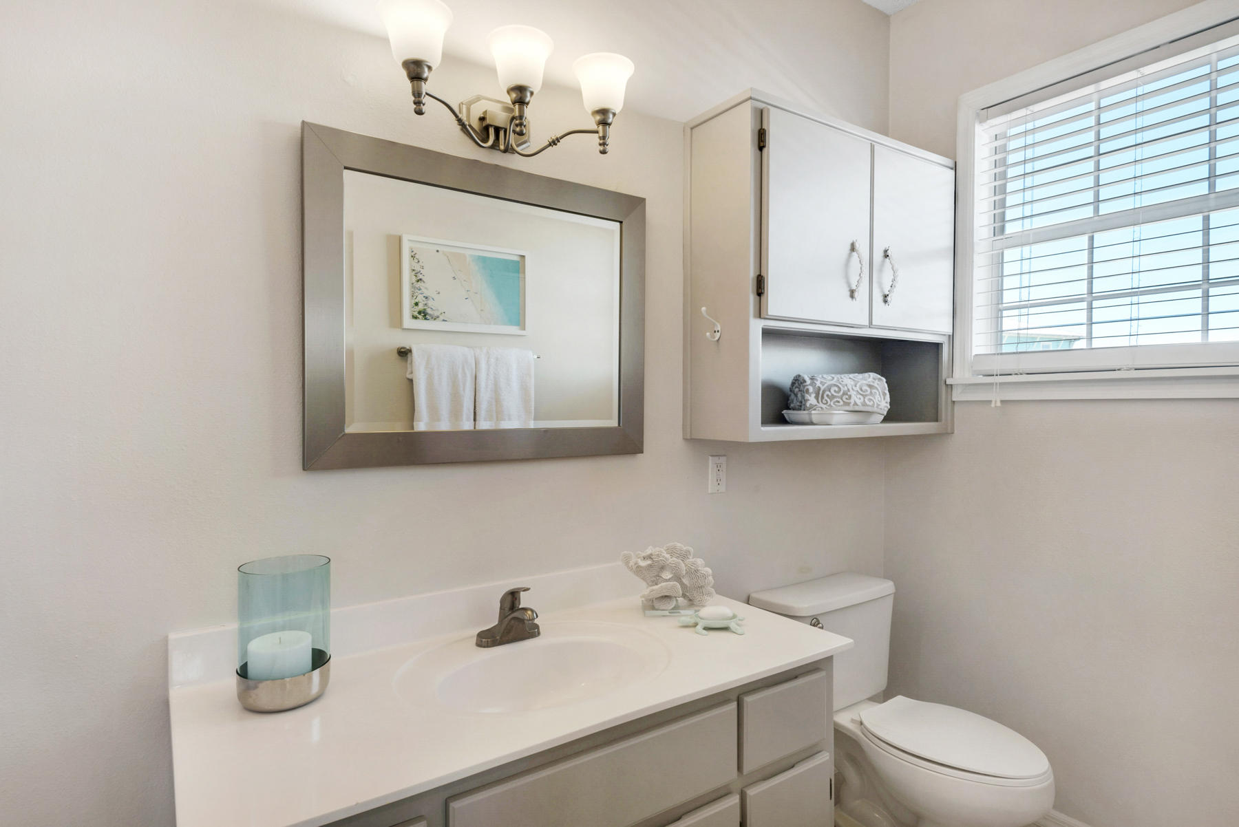 39 Sandy Lane Santa Rosa Beach, FL 32459 - Photo 30 of 87 a bathroom with a toilet a sink and mirror