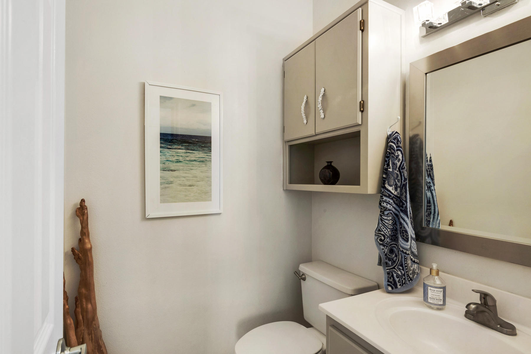 39 Sandy Lane Santa Rosa Beach, FL 32459 - Photo 31 of 87 a bathroom with a toilet sink and mirror