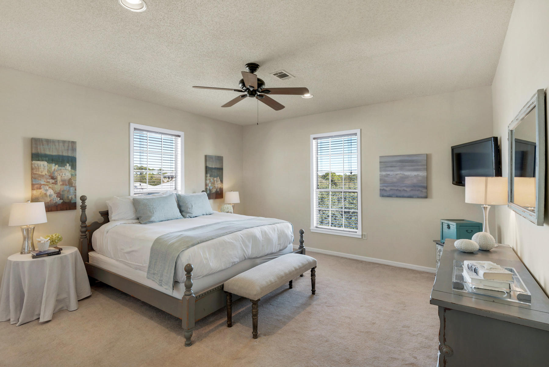 39 Sandy Lane Santa Rosa Beach, FL 32459 - Photo 33 of 87 a spacious bedroom with a bed a couch and a flat tv screen on dresser