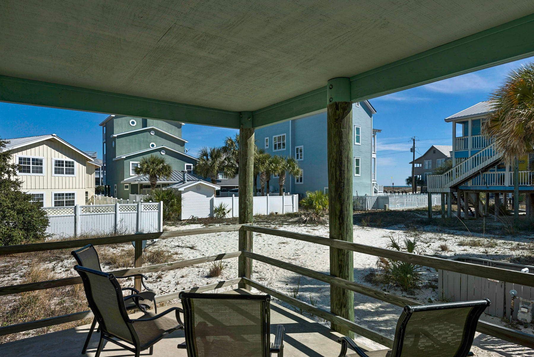 39 Sandy Lane Santa Rosa Beach, FL 32459 - Photo 49 of 87 a view of a patio with table and chairs and potted plants