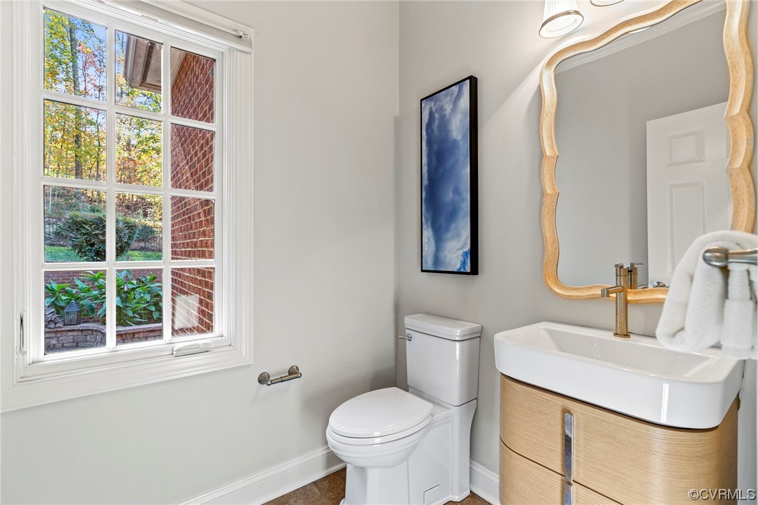 13213 Edmonton Drive Midlothian, VA 23113 - Photo 18 of 49 a bathroom with a toilet sink and mirror