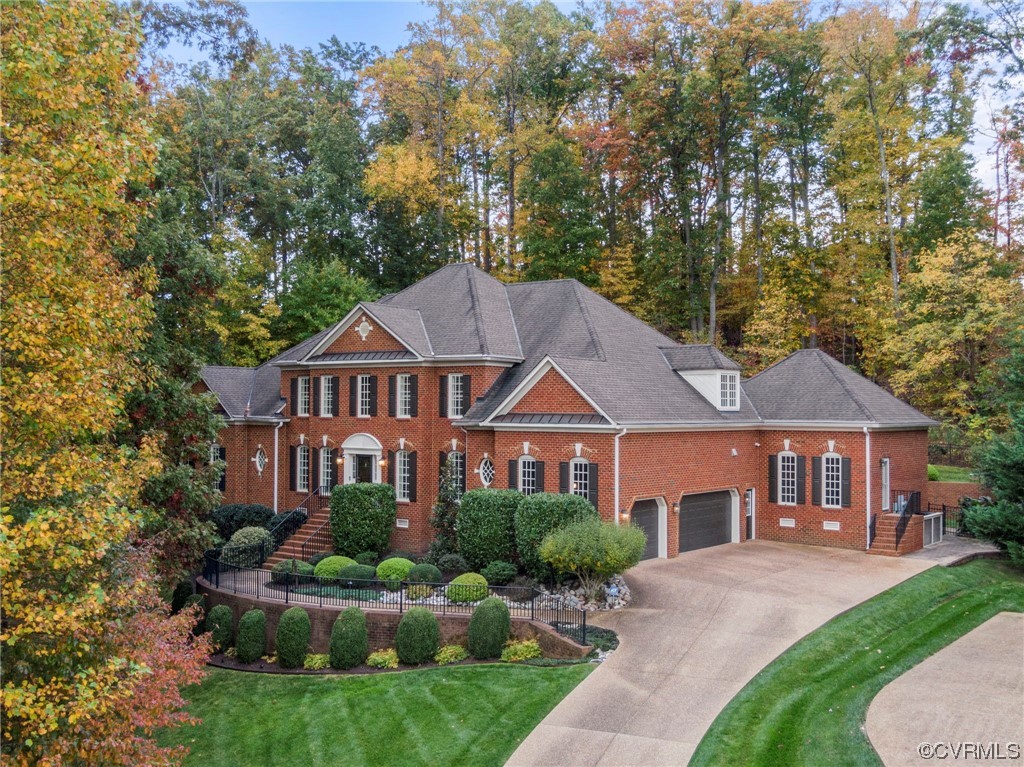 13213 Edmonton Drive Midlothian, VA 23113 - Photo 2 of 49 front view of a house with a yard