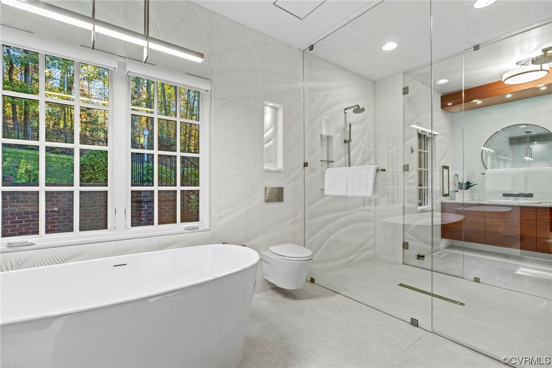 13213 Edmonton Drive Midlothian, VA 23113 - Photo 23 of 49 a bathroom with a tub a toilet and a large window