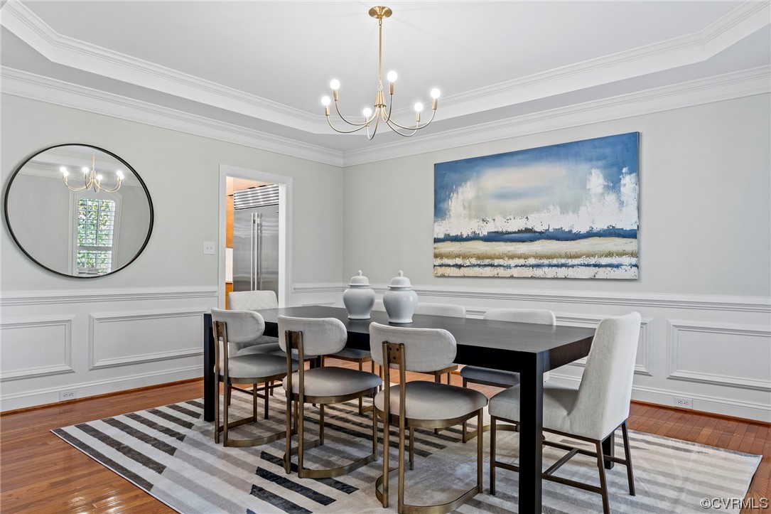 13213 Edmonton Drive Midlothian, VA 23113 - Photo 4 of 49 a view of a dining room with furniture a chandelier and wooden floor
