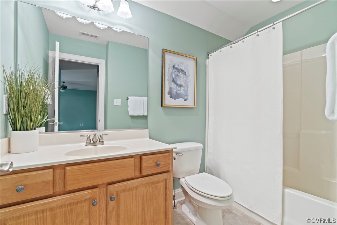 13213 Edmonton Drive Midlothian, VA 23113 - Photo 43 of 49 a bathroom with a toilet sink and mirror