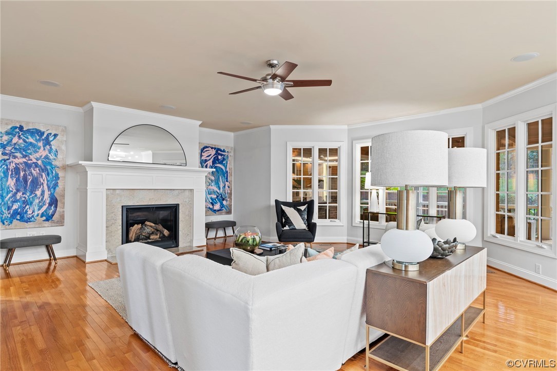 13213 Edmonton Drive Midlothian, VA 23113 - Photo 6 of 49 a living room with furniture a fireplace and a floor to ceiling window