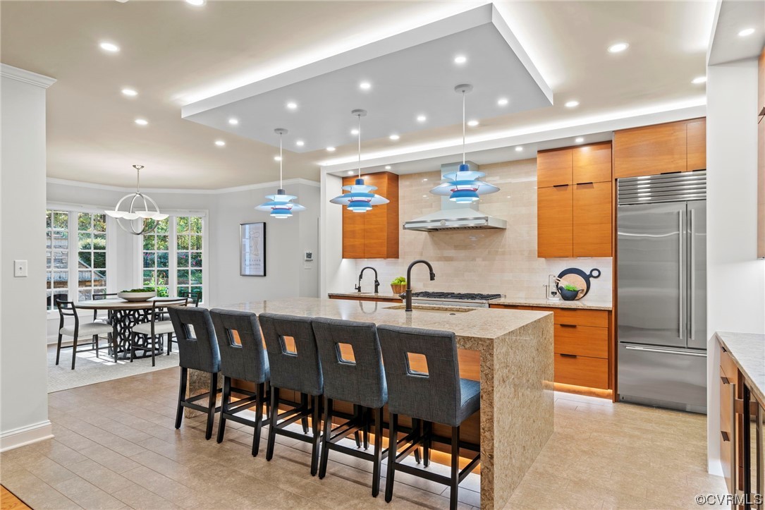 13213 Edmonton Drive Midlothian, VA 23113 - Photo 10 of 49 a kitchen with stainless steel appliances granite countertop dining table chairs and wooden floor