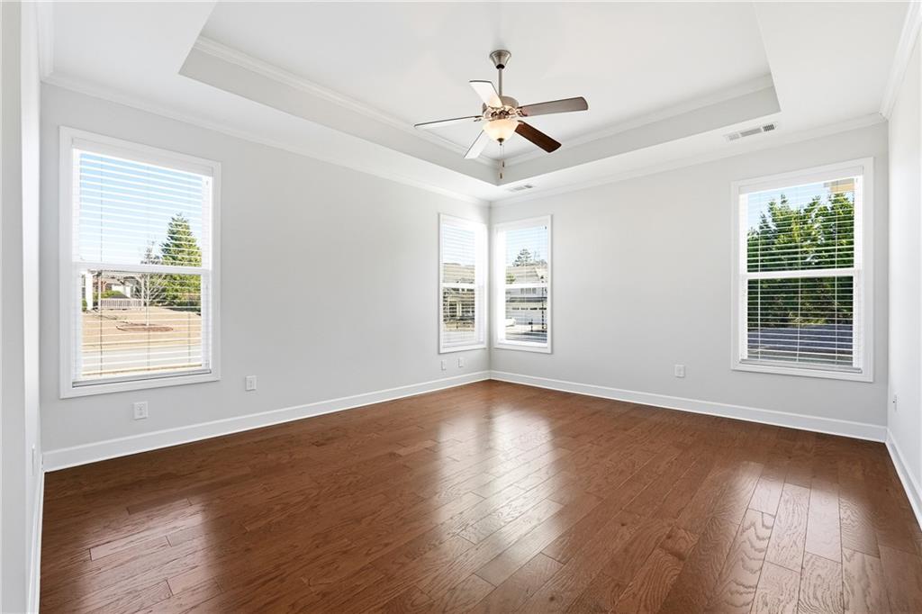 3751 Golden Leaf Point Southwest Gainesville, GA 30504 - Photo 14 of 45 a view of an empty room with wooden floor and a window