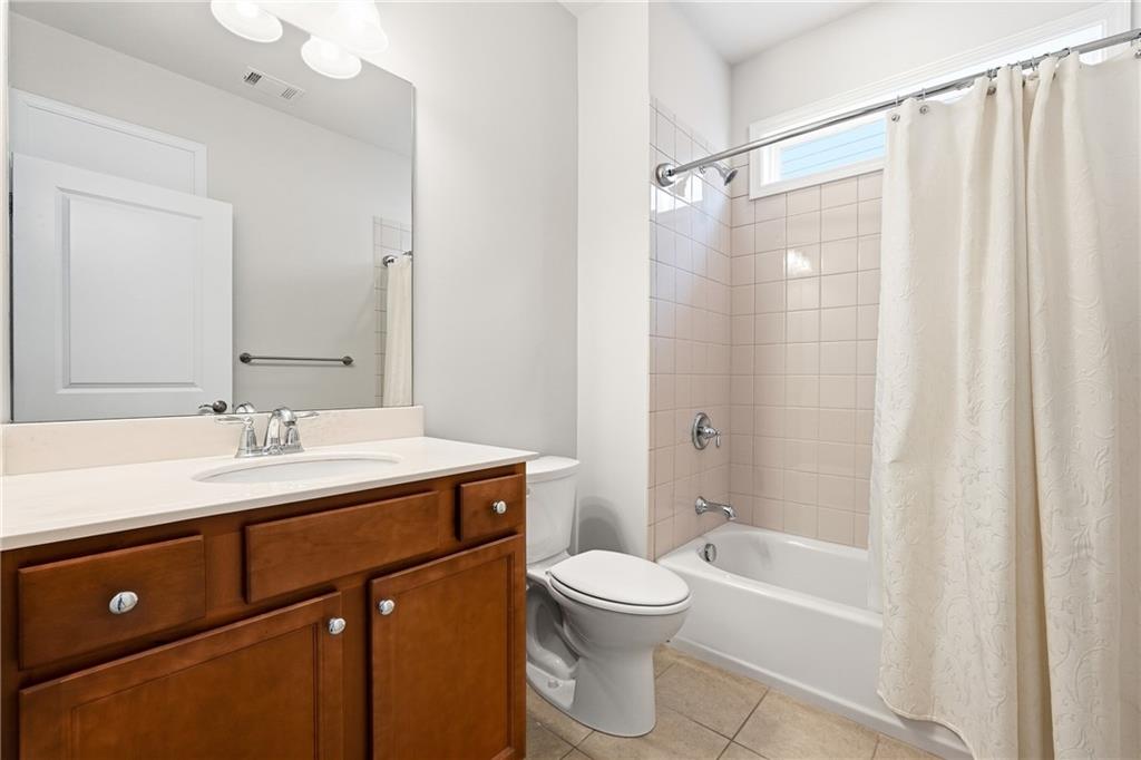 3751 Golden Leaf Point Southwest Gainesville, GA 30504 - Photo 20 of 45 a bathroom with a sink a toilet and shower