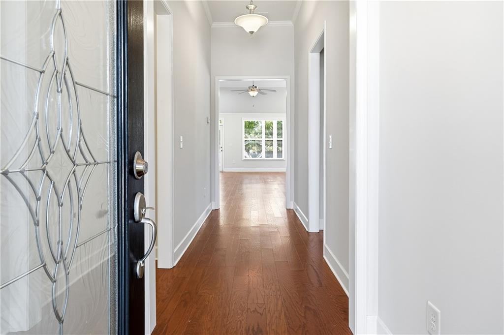 3751 Golden Leaf Point Southwest Gainesville, GA 30504 - Photo 2 of 45 a view of a hallway with wooden floor and staircase