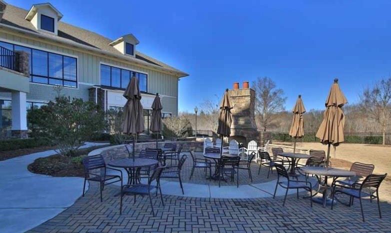 3751 Golden Leaf Point Southwest Gainesville, GA 30504 - Photo 39 of 45 a view of a dinning tables and chairs in the patio