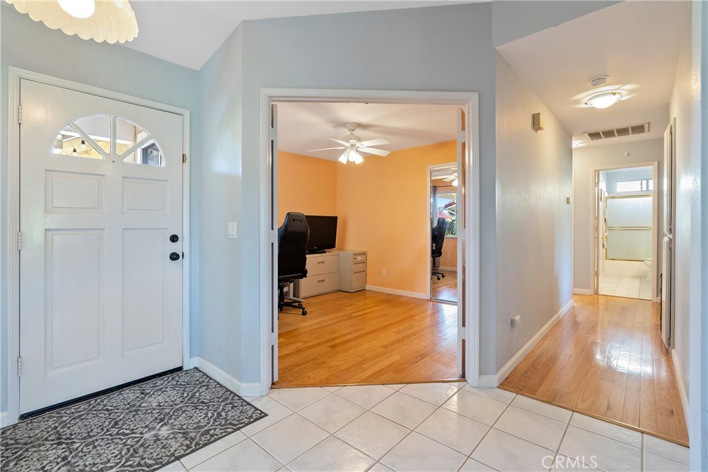 918 Inverness Drive Paso Robles, CA 93446 - Photo 12 of 38 a view of a hallway with wooden floor and a living room