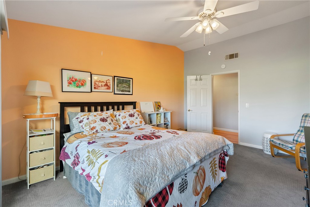 918 Inverness Drive Paso Robles, CA 93446 - Photo 14 of 38 a bedroom with a bed and a chandelier