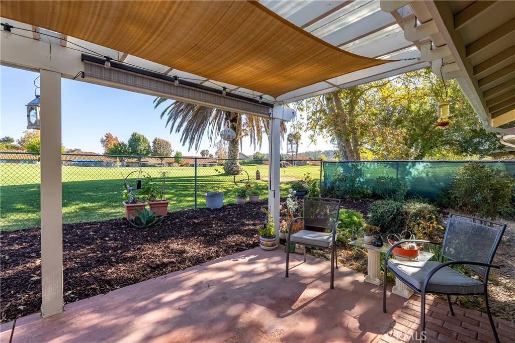 918 Inverness Drive Paso Robles, CA 93446 - Photo 25 of 38 a view of a chairs and table in patio with a backyard