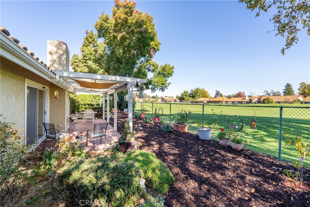 918 Inverness Drive Paso Robles, CA 93446 - Photo 26 of 38 a view of a chair and tables in the garden