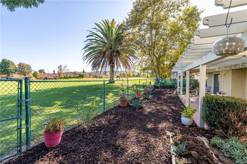 918 Inverness Drive Paso Robles, CA 93446 - Photo 28 of 38 a front view of a house with a yard and potted plants