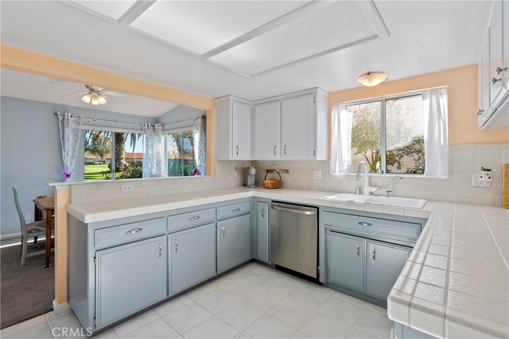 918 Inverness Drive Paso Robles, CA 93446 - Photo 8 of 38 a kitchen with a sink window and cabinets