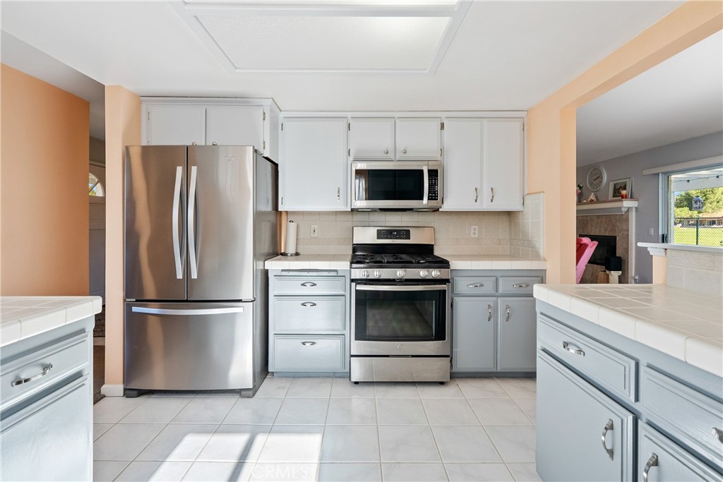 918 Inverness Drive Paso Robles, CA 93446 - Photo 9 of 38 a kitchen with cabinets stainless steel appliances and a counter space