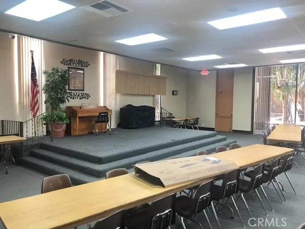 a dining room with furniture and window