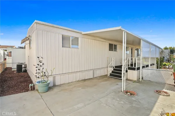 a house view with a backyard space