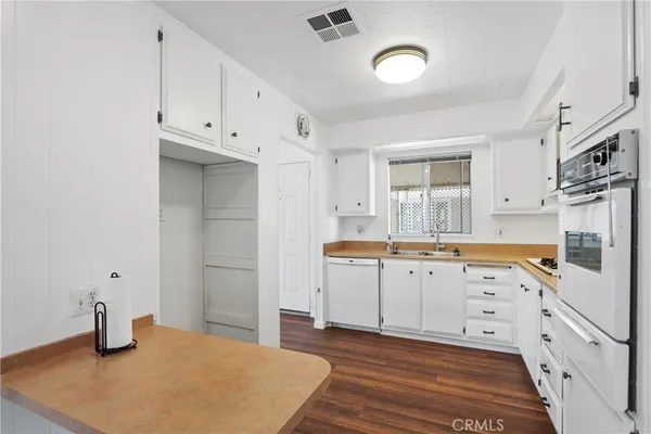 a spacious bathroom with a sink and a mirror