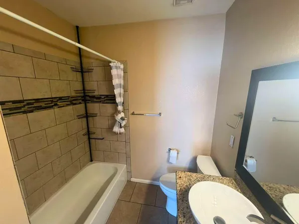 a bathroom with a sink and toilet